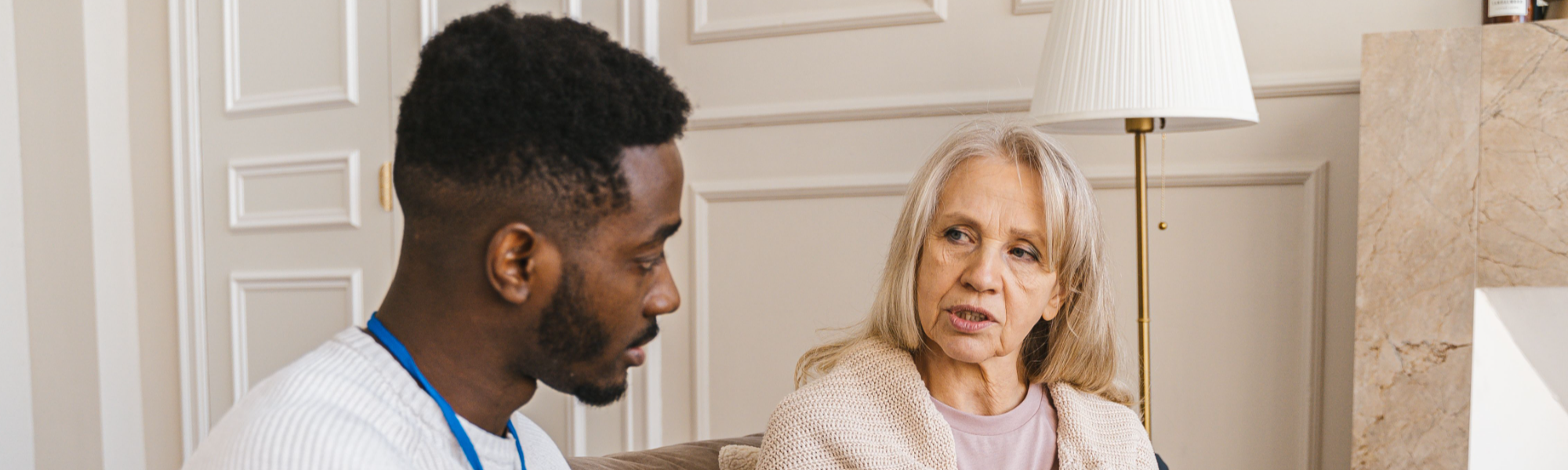 Man and woman talking during social care visit